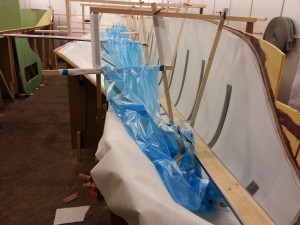Supports on the bulkheads make it easier to apply the vacuum bag in the hull